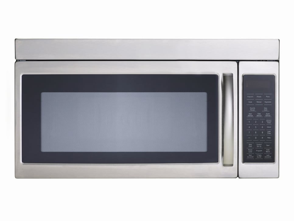 Stainless steel microwave oven on white